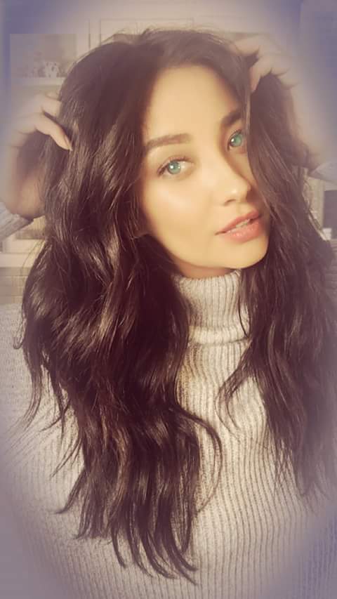 Shay Mitchell taking a selfie