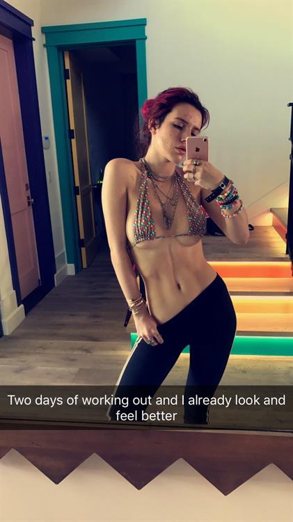 Bella Thorne in a bikini taking a selfie