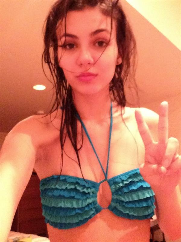 Victoria Justice in a bikini taking a selfie