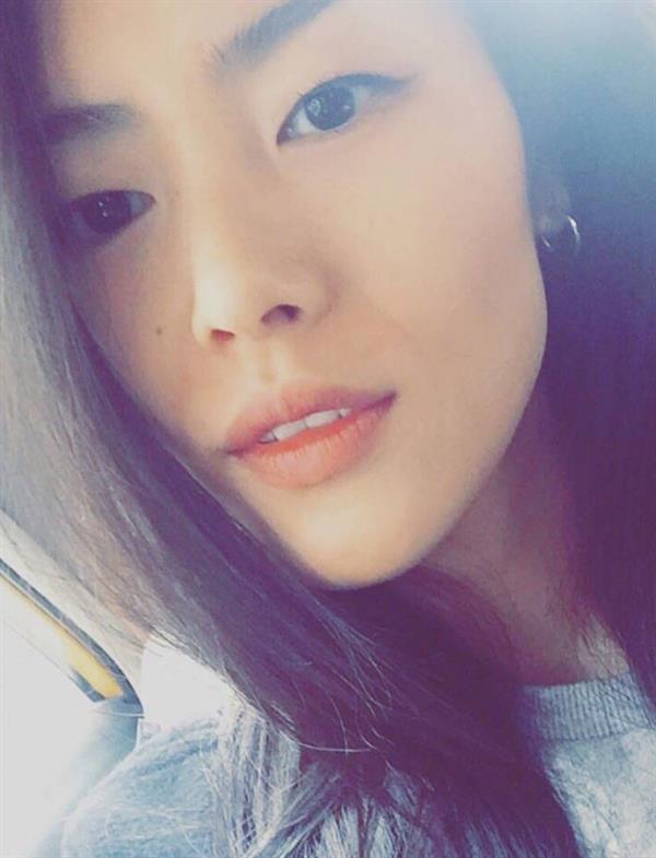 Liu Wen taking a selfie