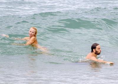Pamela Anderson Pamela Anderson Going topless at the beach in France 02.10.13