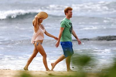 Pamela Anderson Takes a walk in bikini bottoms on the Island of Maui December 30, 2012 