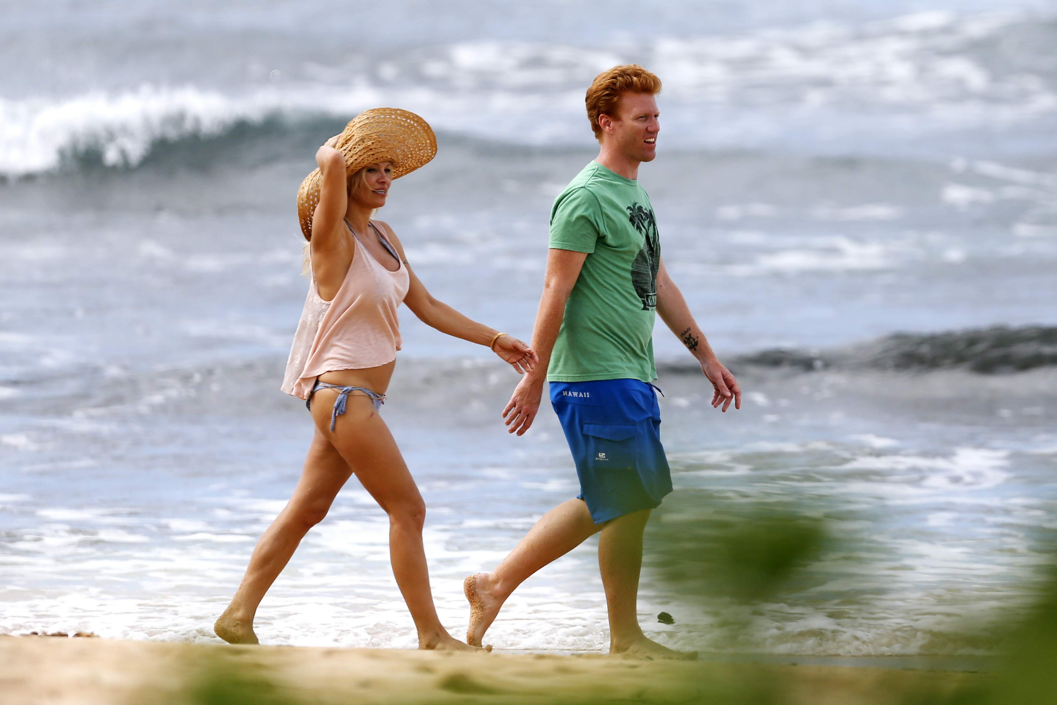 Pamela Anderson Takes a walk in bikini bottoms on the Island of Maui December 30, 2012 
