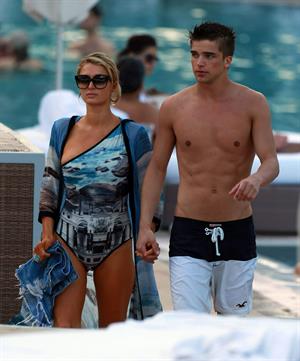 Paris Hilton spends the day in and out of the pool in Miami December 8, 2012