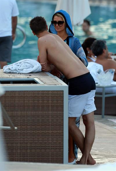 Paris Hilton spends the day in and out of the pool in Miami December 8, 2012