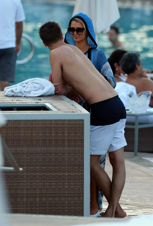Paris Hilton spends the day in and out of the pool in Miami December 8, 2012