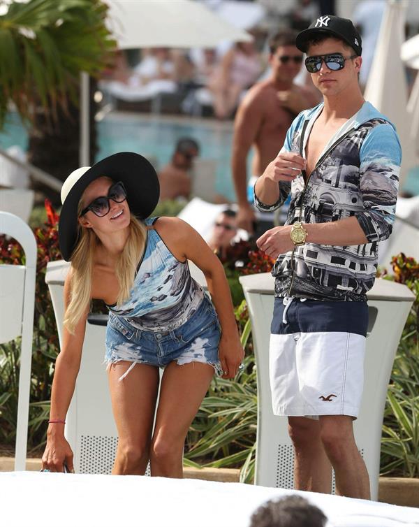 Paris Hilton spends the day in and out of the pool in Miami December 8, 2012