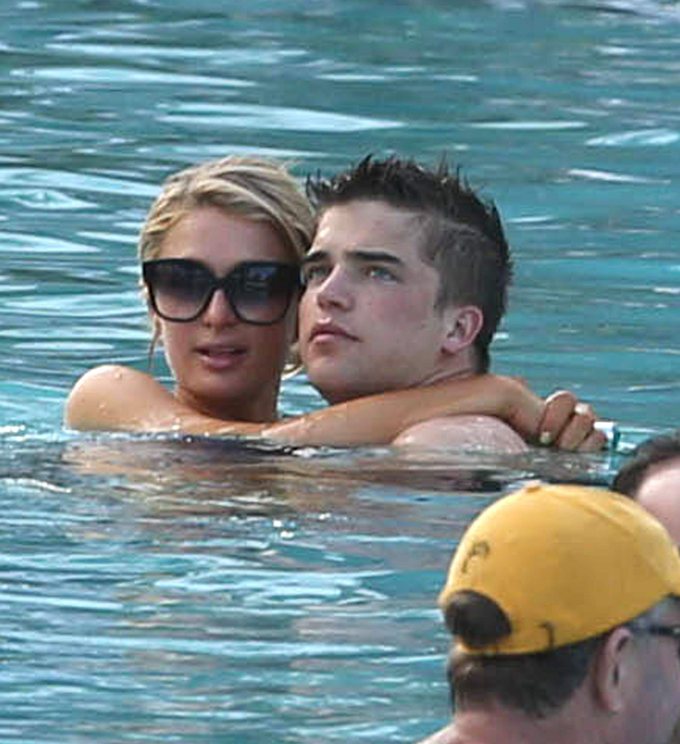 Paris Hilton spends the day in and out of the pool in Miami December 8, 2012
