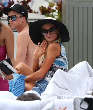 Paris Hilton spends the day in and out of the pool in Miami December 8, 2012