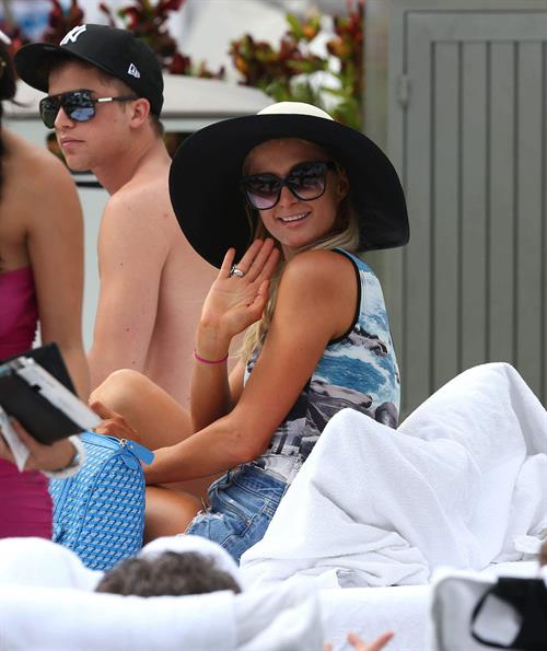 Paris Hilton spends the day in and out of the pool in Miami December 8, 2012