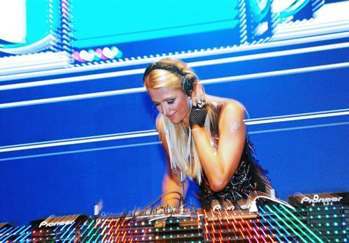 Paris Hilton walks for designer duo Shane and Falguni Peacock and performs as a DJ at the India Resort Fashion Week