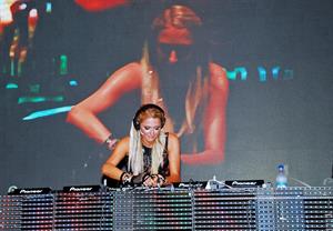 Paris Hilton walks for designer duo Shane and Falguni Peacock and performs as a DJ at the India Resort Fashion Week