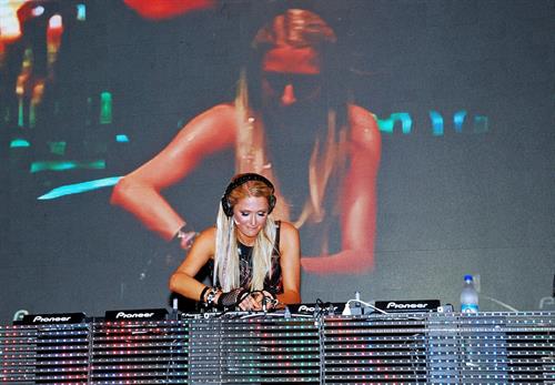 Paris Hilton walks for designer duo Shane and Falguni Peacock and performs as a DJ at the India Resort Fashion Week