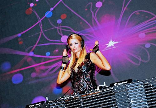 Paris Hilton walks for designer duo Shane and Falguni Peacock and performs as a DJ at the India Resort Fashion Week