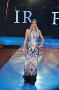 Paris Hilton walks for designer duo Shane and Falguni Peacock and performs as a DJ at the India Resort Fashion Week