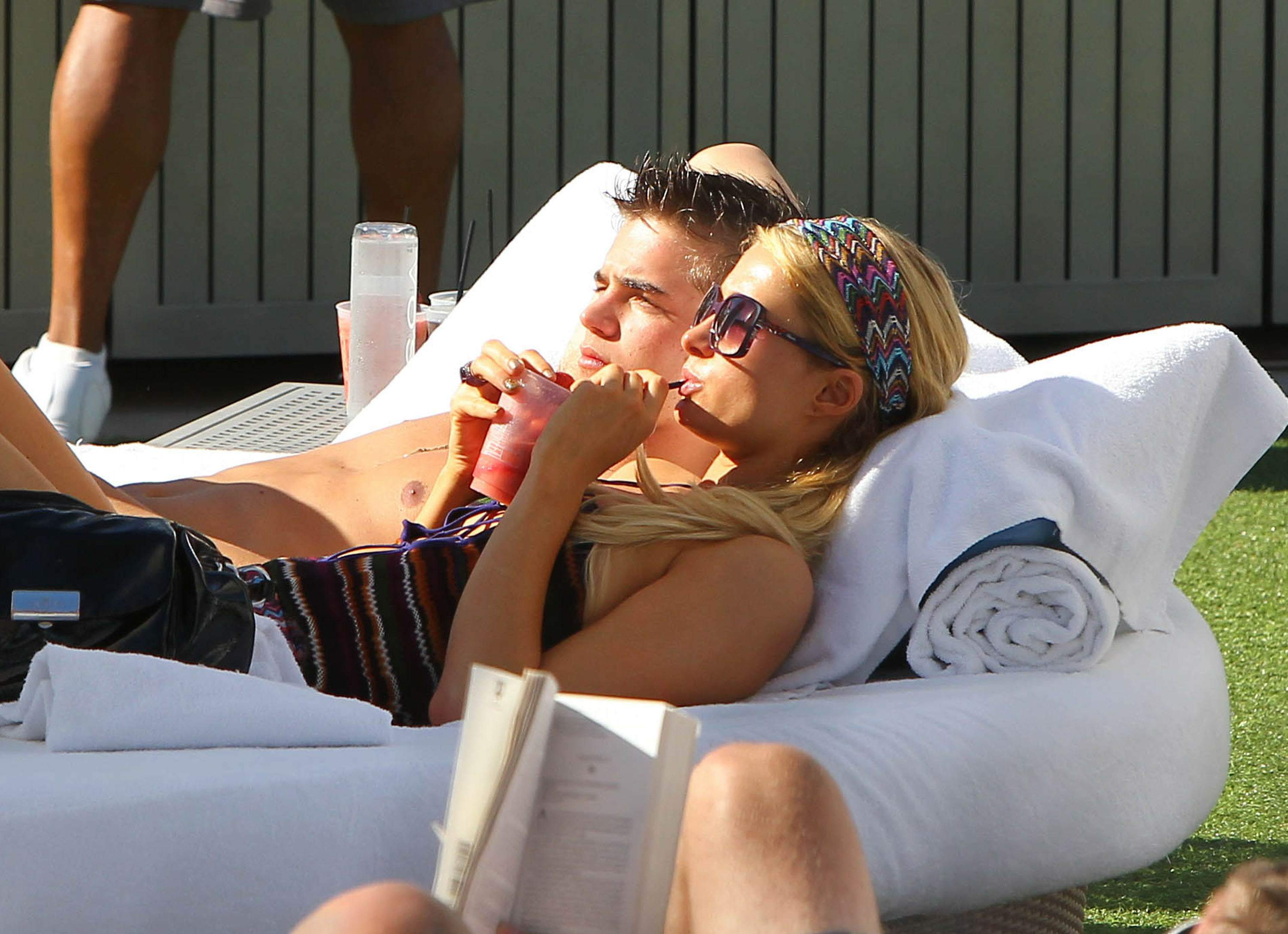 Paris Hilton poolside at their Miami hotel December 7-2012 