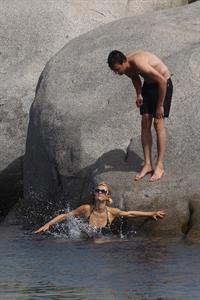Paris Hilton - Wearing a swimsuit at a beach in France August 6, 2012