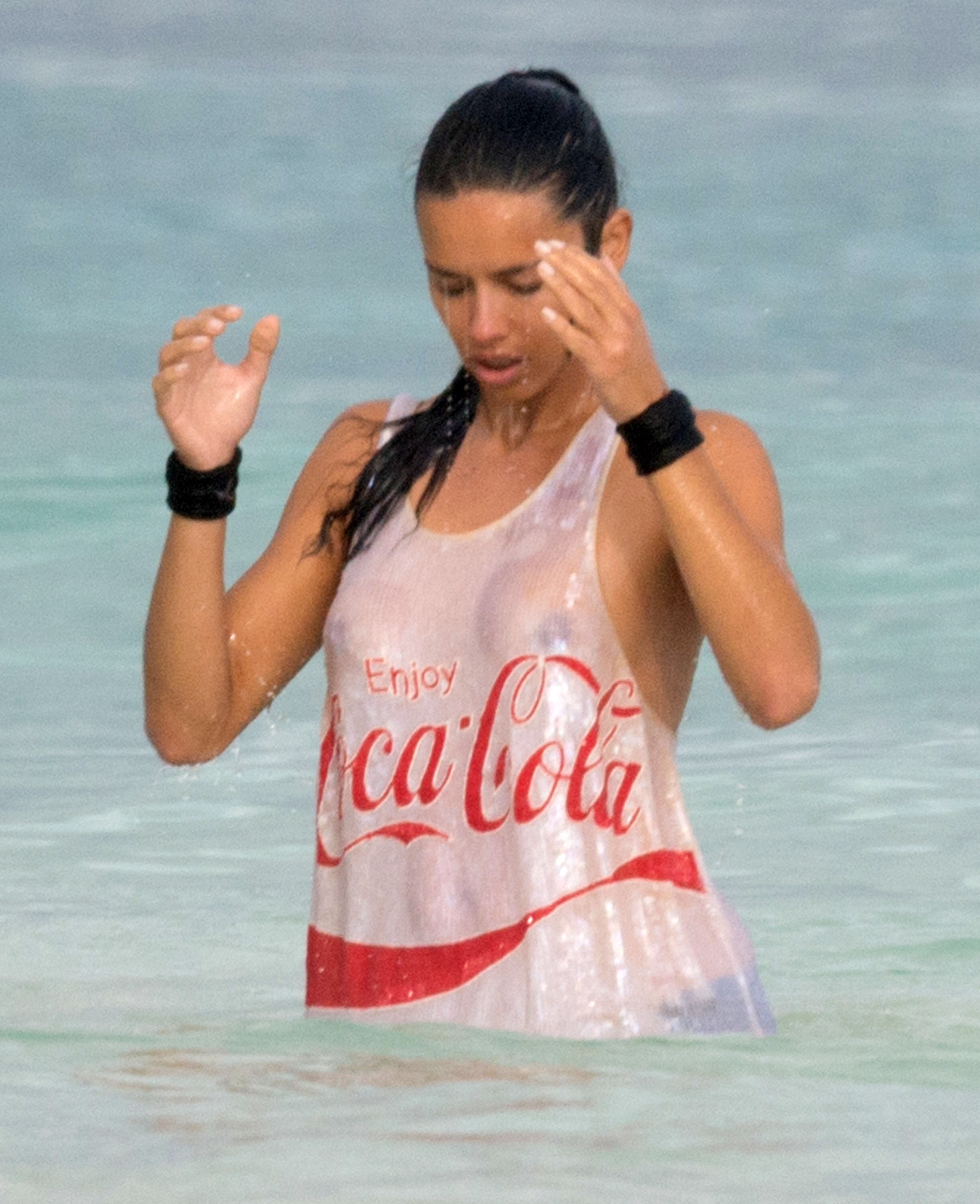 Adriana Lima – beach shoot candids in Cancun 12/2/13 