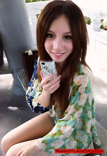 Lin Cai Ti taking a selfie