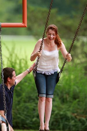 Alyson Hannigan playing in a park in Atlanta July 28, 2011 