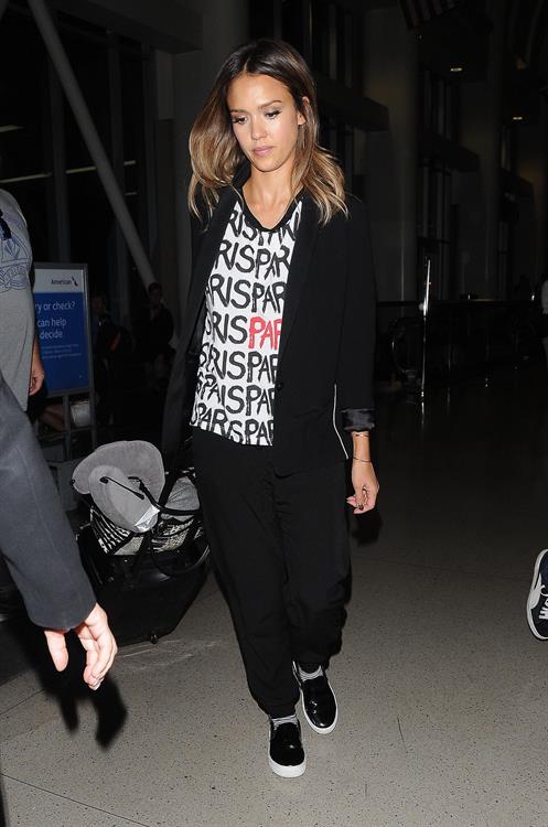 Jessica Alba arriving at LAX August 05, 2014