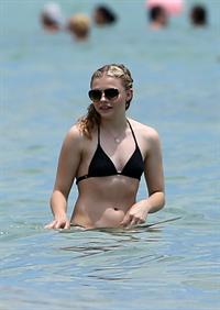 Chloe Grace Moretz candids in a Black Bikini in Miami Beach