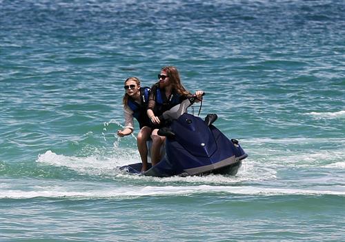 Chloe Grace Moretz candids in a Black Bikini in Miami Beach