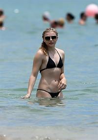 Chloe Grace Moretz candids in a Black Bikini in Miami Beach