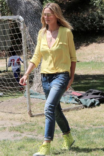 Heidi Klum out for lunch in Brentwood in a yellow shirt