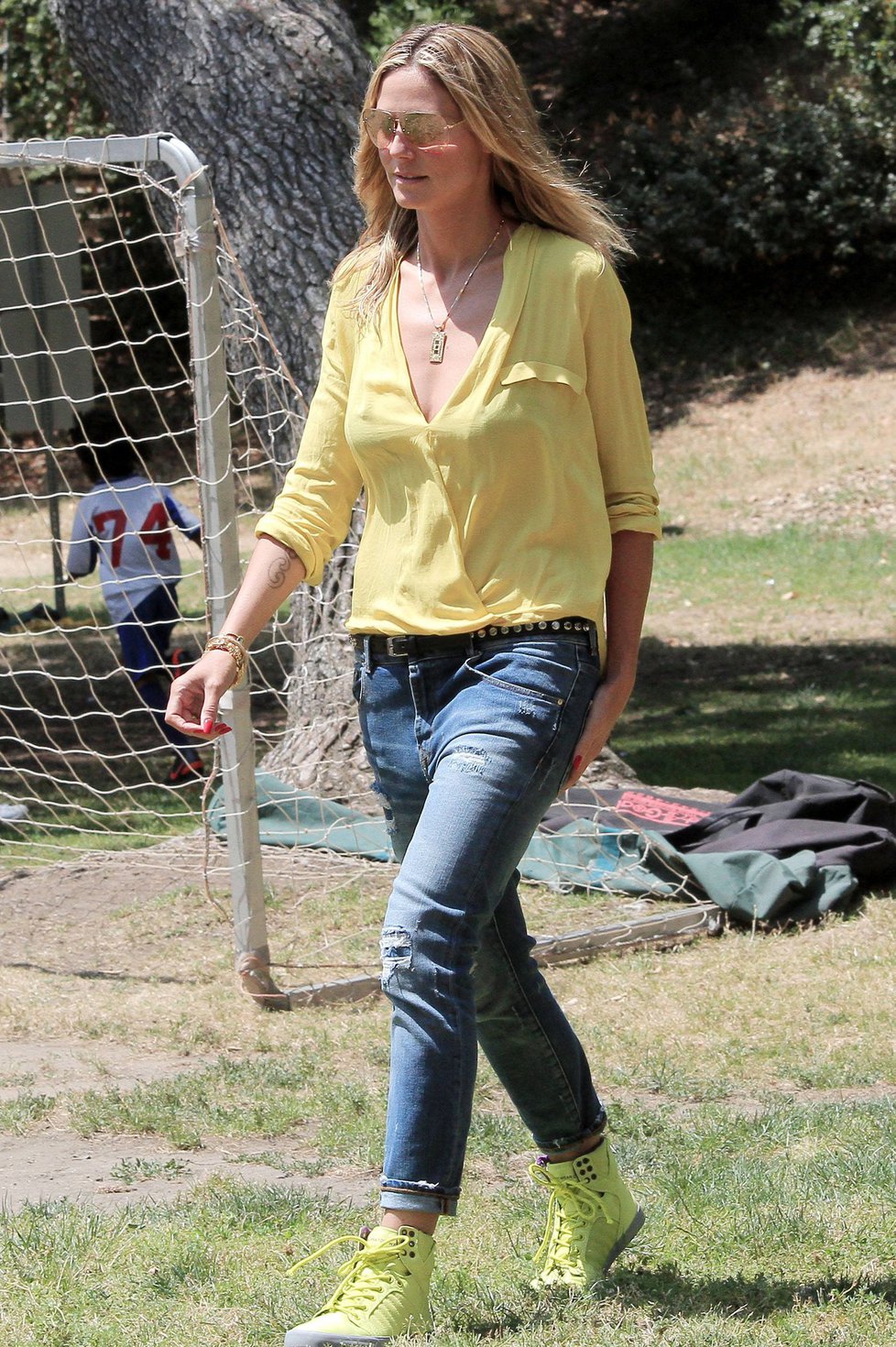 Heidi Klum out for lunch in Brentwood in a yellow shirt