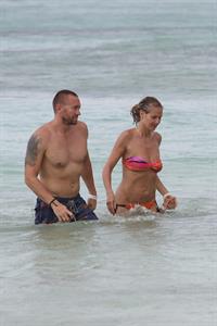 Heidi Klum wearing a bikini on a beach in the Bahamas on July 6, 2013