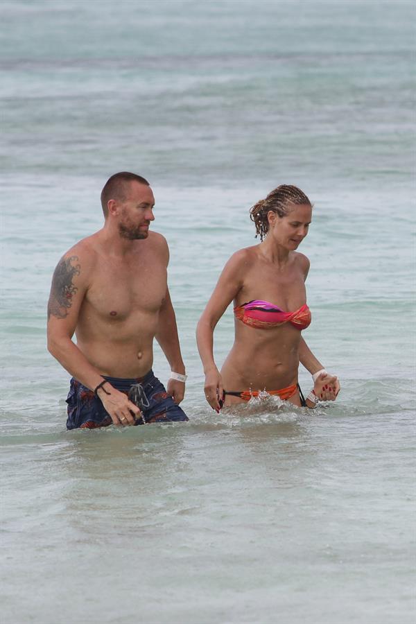 Heidi Klum wearing a bikini on a beach in the Bahamas on July 6, 2013