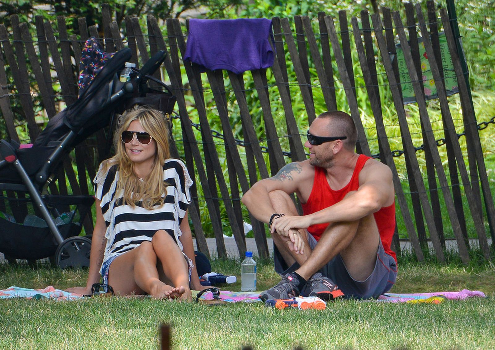Heidi Klum in a black and white striped shirt, spends a day out in a park in Tribeca on June 30, 2013 