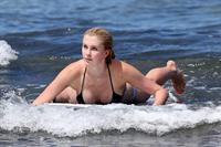 Ireland Baldwin goes paddle-boarding in Hawaii with her boyfriend Slater Trout May 26, 2013 