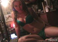 Kari Sweets in her room with green lingerie