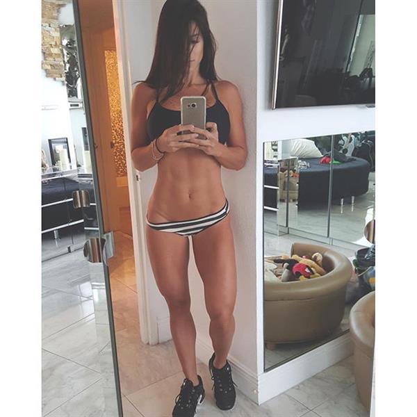Michelle Lewin in a bikini taking a selfie