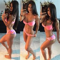Michelle Lewin in a bikini taking a selfie