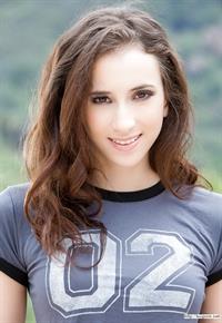 Clothed babe Belle Knox stripping off shorts and panties outdoors