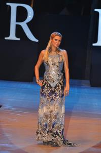 Paris Hilton walks for designer duo Shane and Falguni Peacock and performs as a DJ at the India Resort Fashion Week