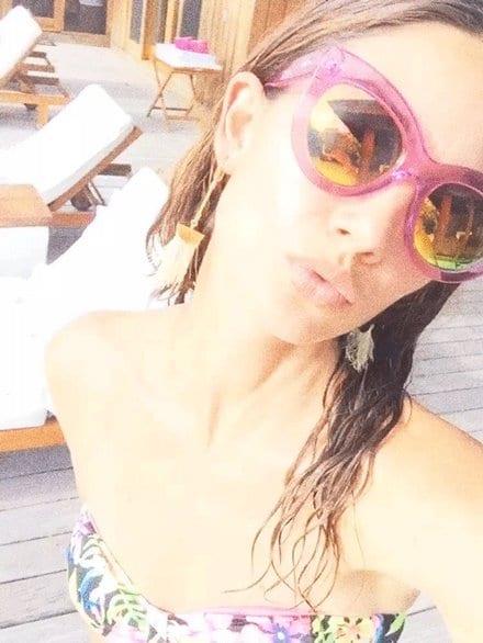 Lily Aldridge in a bikini taking a selfie
