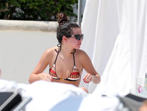 Selena Gomez in bikini by a hotel pool in Miami 5/11/13 