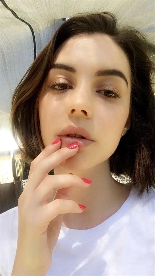 Adelaide Kane taking a selfie