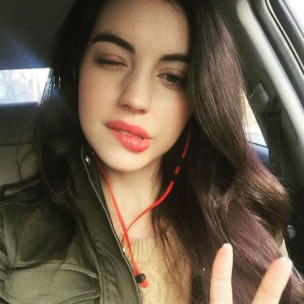 Adelaide Kane taking a selfie