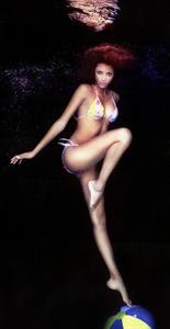 Noémie Lenoir in a bikini