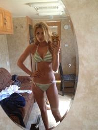 Aly Michalka in a bikini taking a selfie