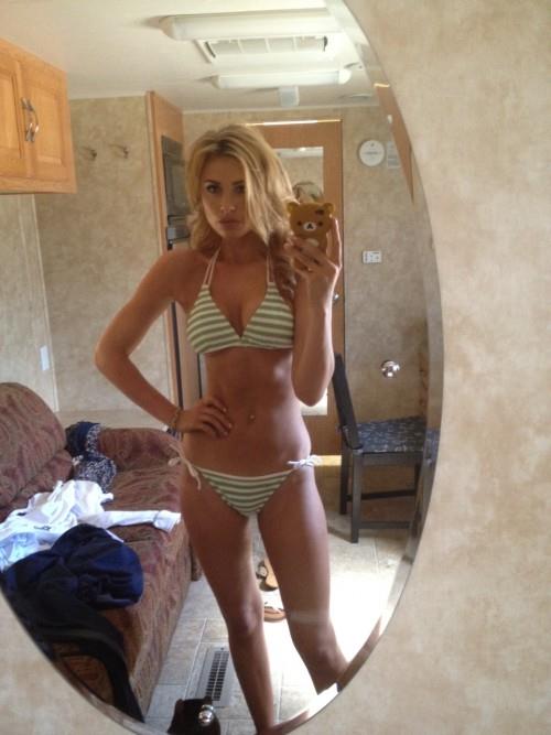 Aly Michalka in a bikini taking a selfie