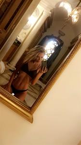 Amber Davis in a bikini taking a selfie