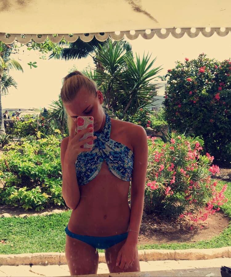 Anonymous in a bikini taking a selfie