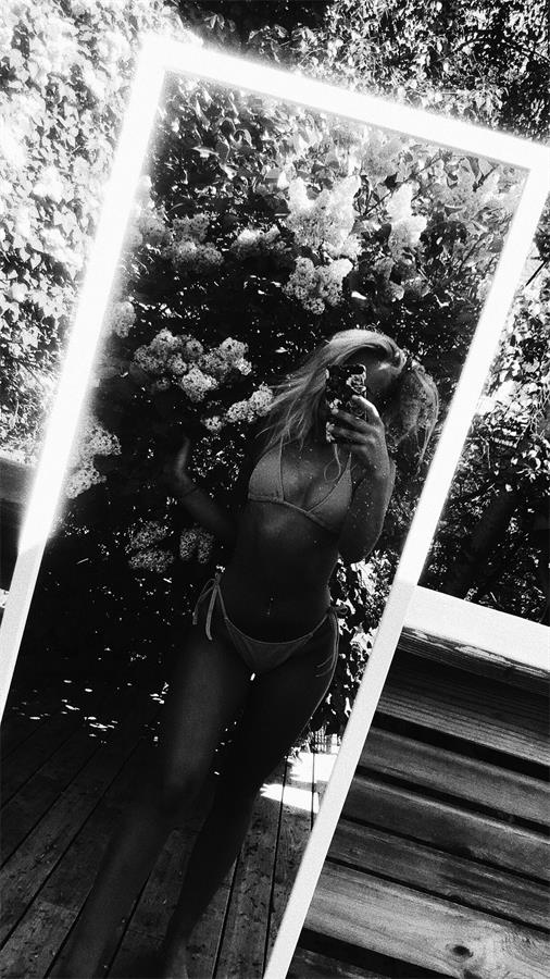 stina jonsson in a bikini taking a selfie
