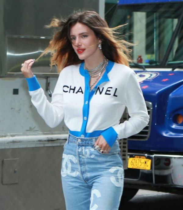 Bella Thorne braless tits seen by paparazzi showing her pierced nipple dressed all in Chanel.






